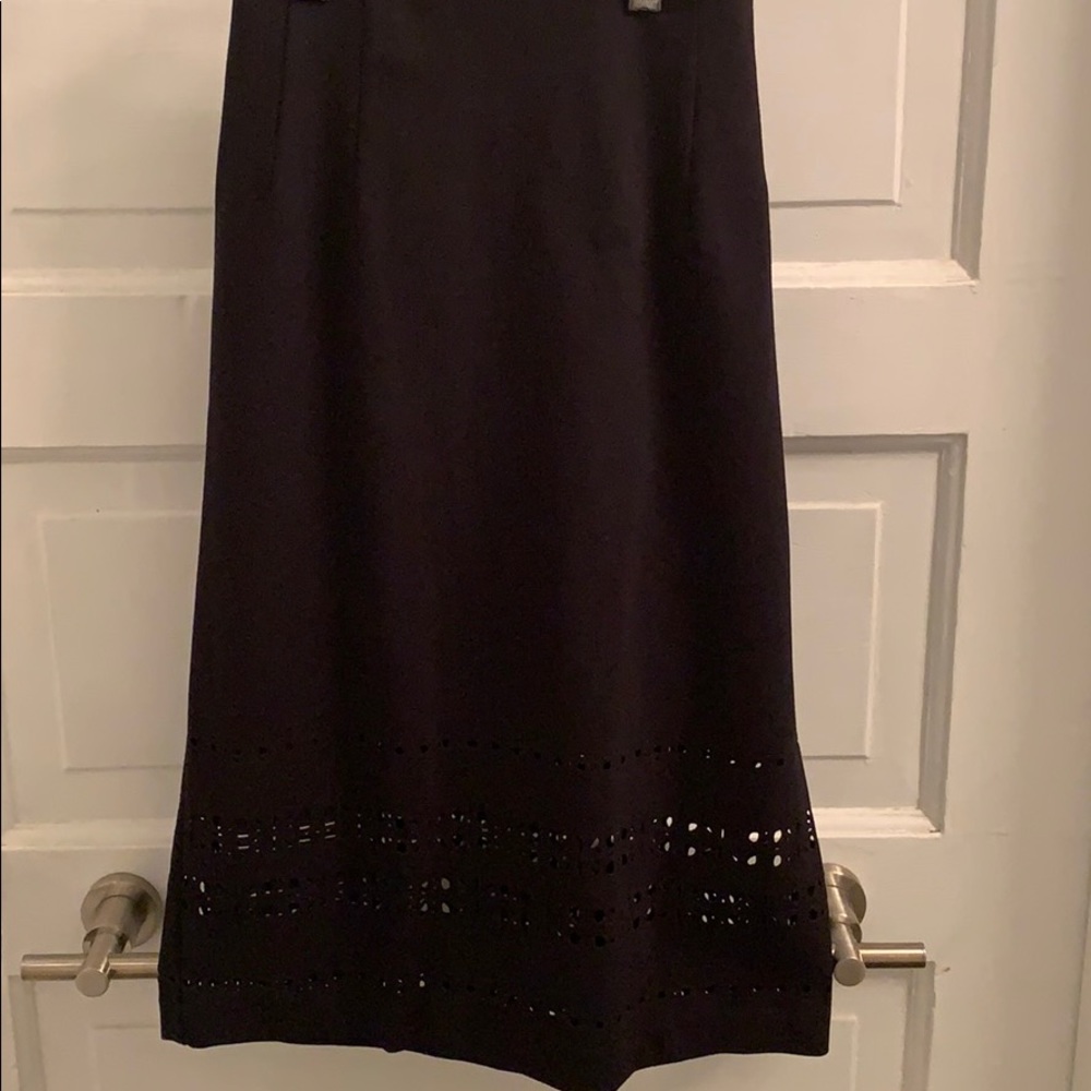 Black laser-cut pencil skirt by Amanda + Chelsea